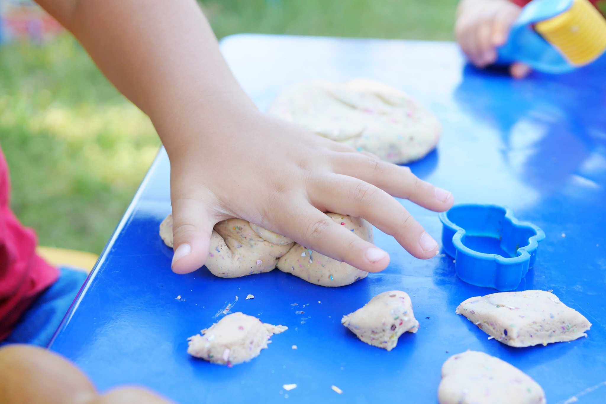 A child exploring play dough