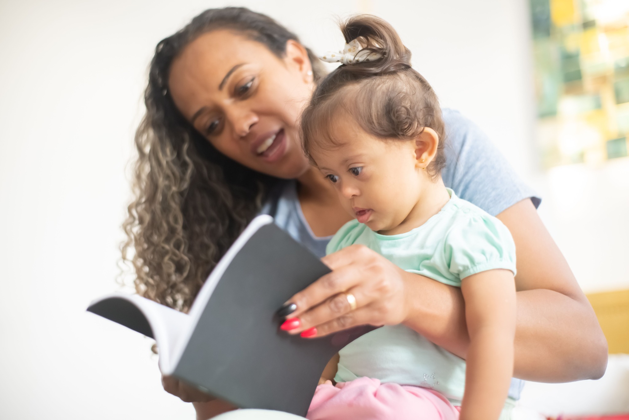 A parent reading with a young child